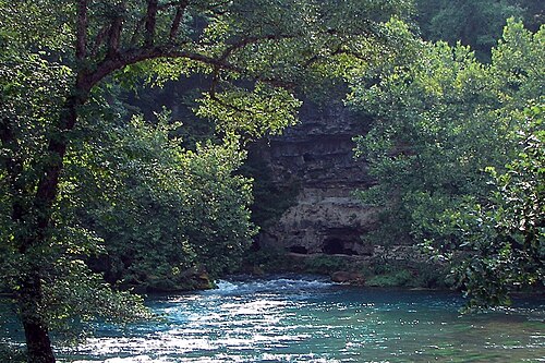 Water that flows up naturally out of the ground.